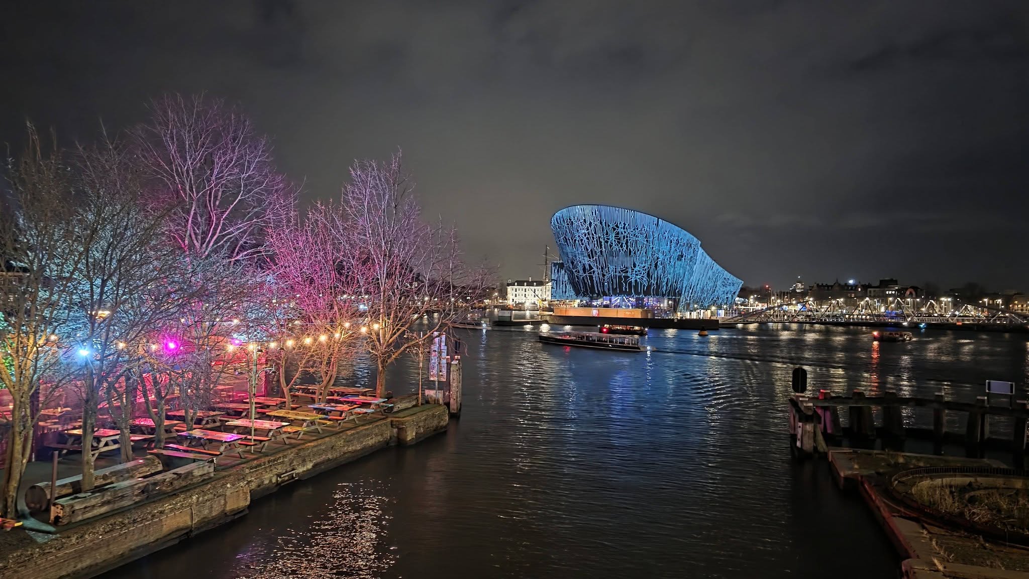 Colourful lights beside Amsterdam’s waterfront on a December evening