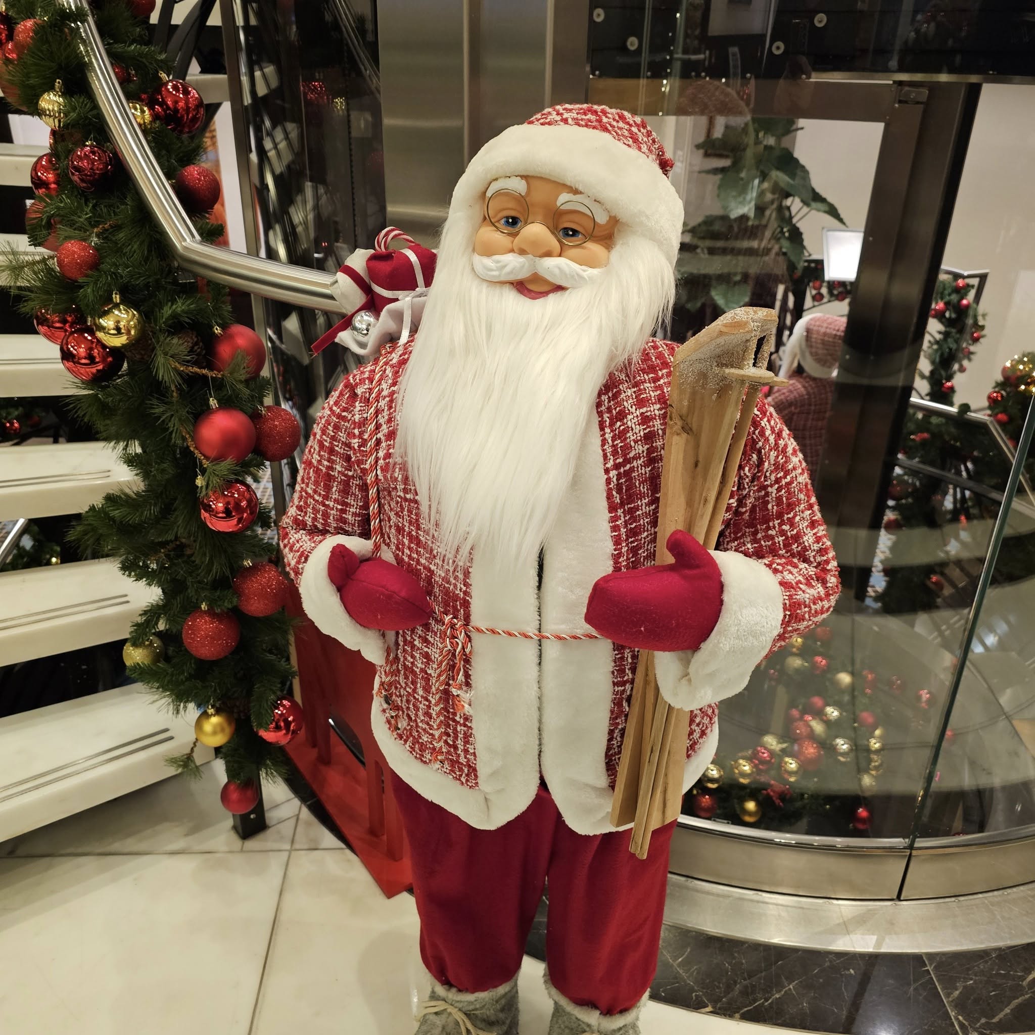 A Father Christmas decoration beside AmaSonata’s staircase
