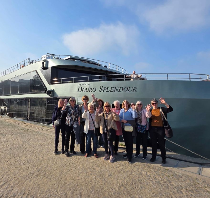 Solo travellers gathered beside the Douro Splendour river ship in Porto