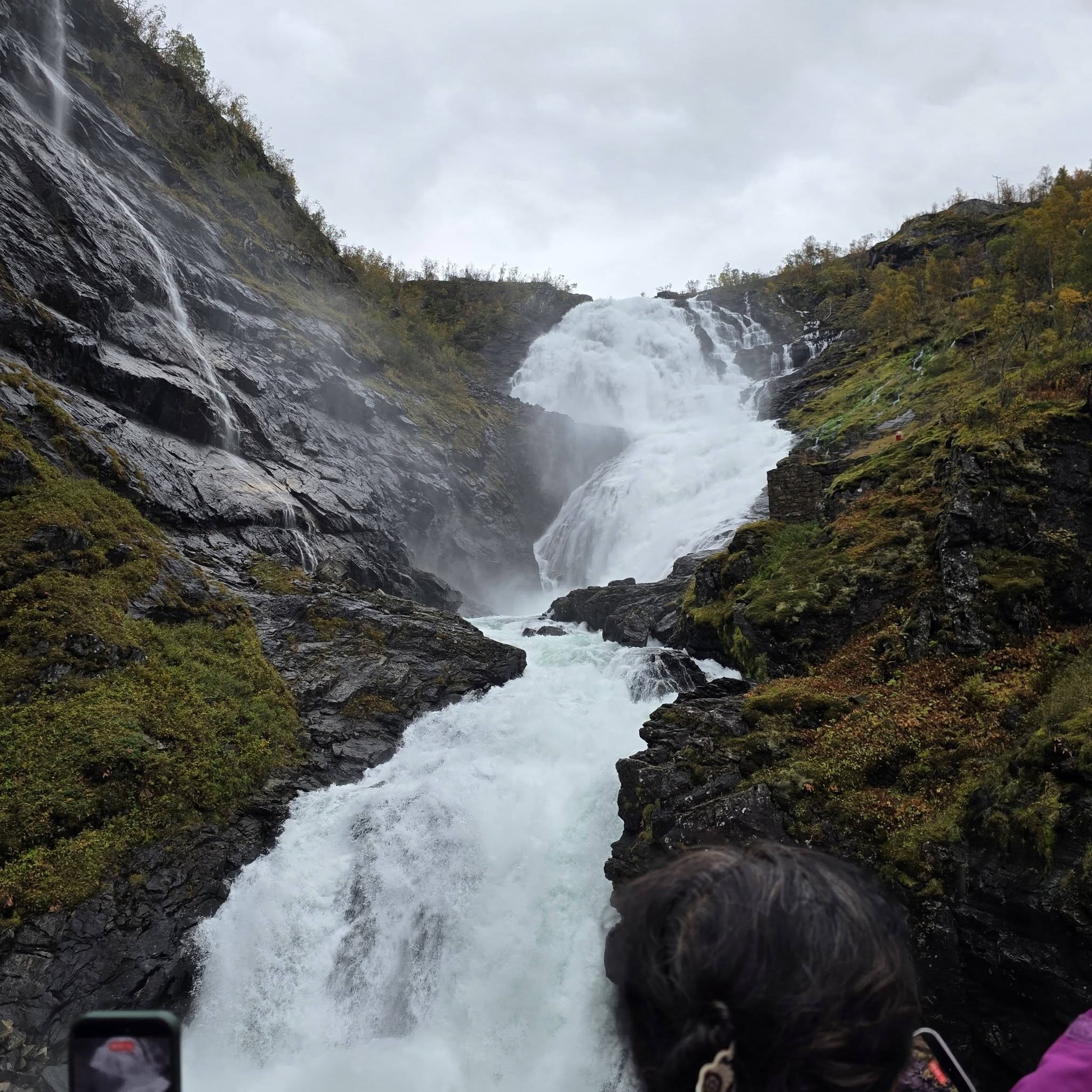 A waterfall running through the rocky Norwegian mountains