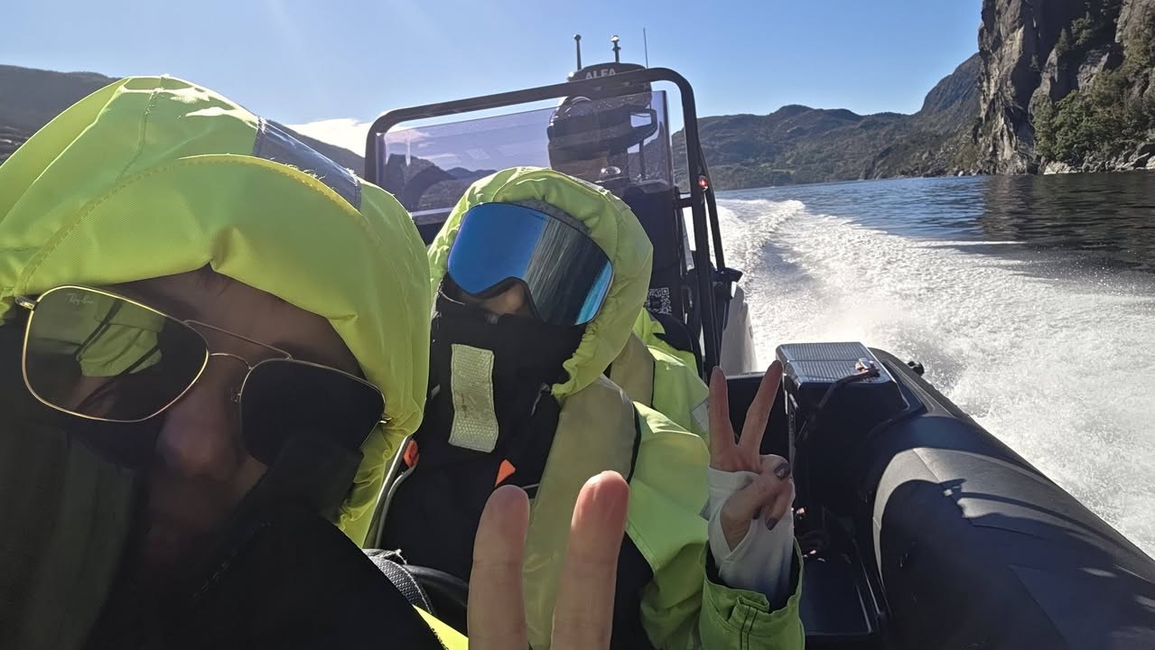 Passengers in bright weatherproof clothing aboard the Lysefjord RIB